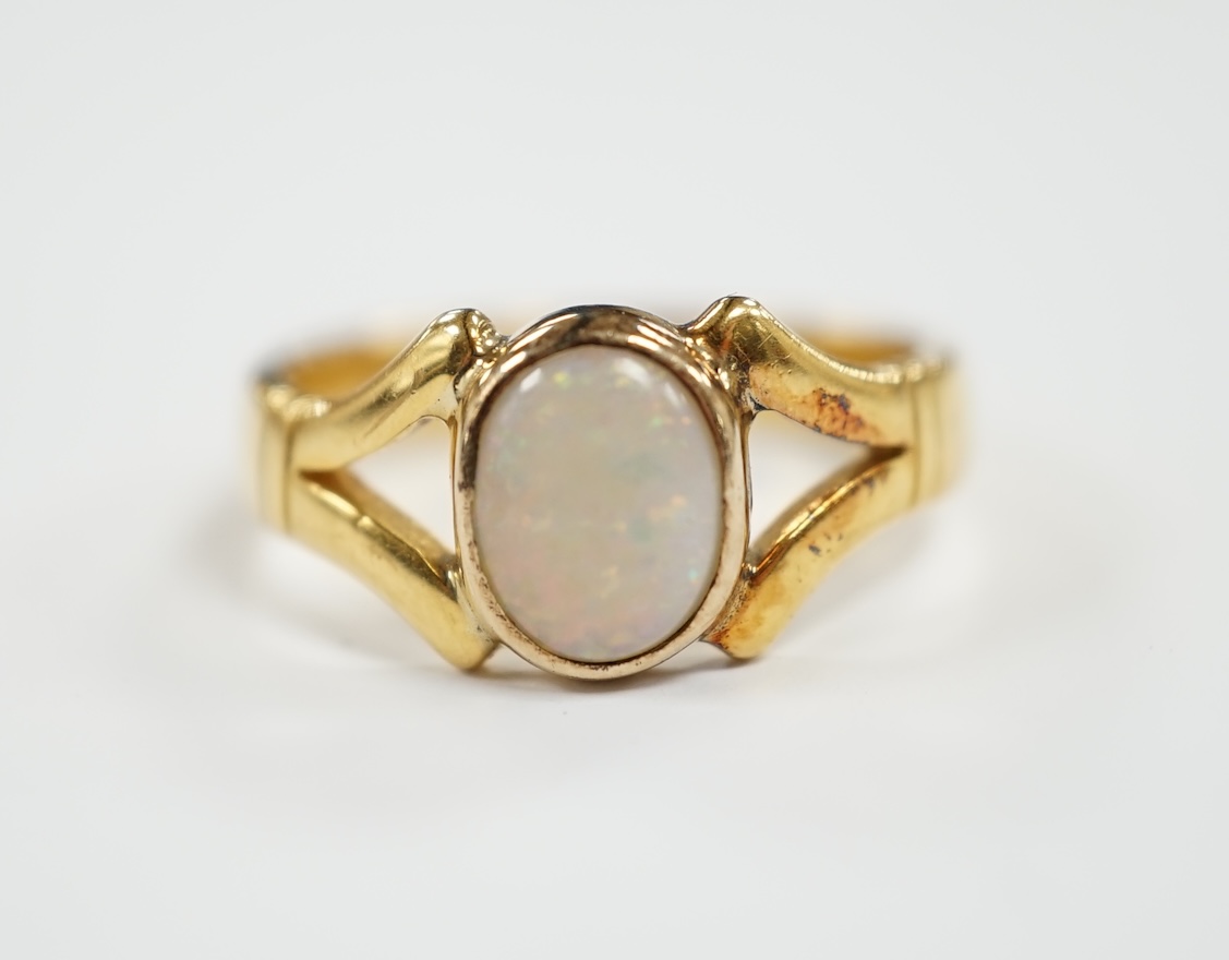 A George V 22ct gold and single stone cabochon white opal set ring, size P/Q, gross weight 6.5 grams.